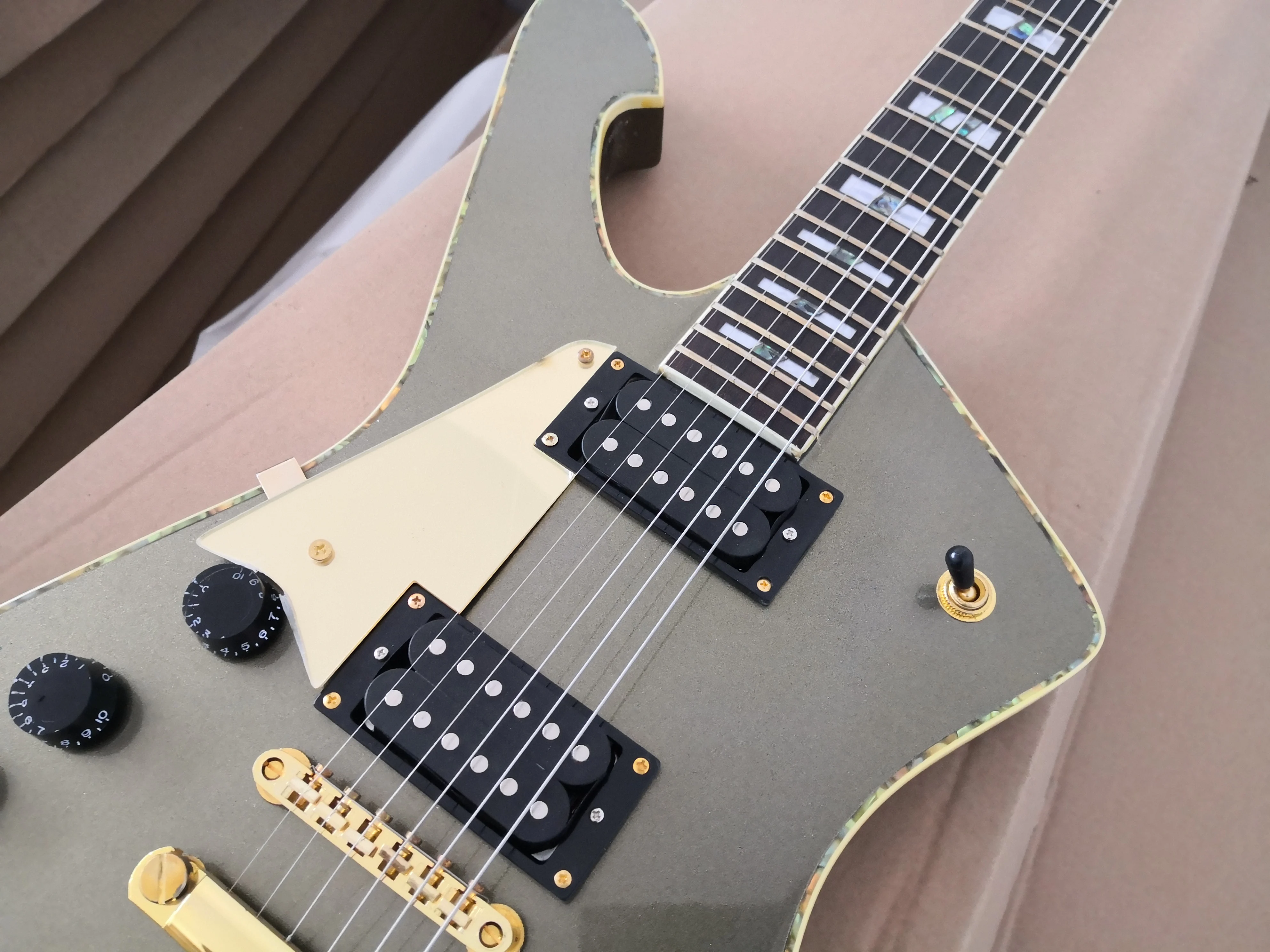 orphan  unique  guitar 6 string left hand guitar ,golden bridge,HH pickups,pearl shell binding,neck set in body