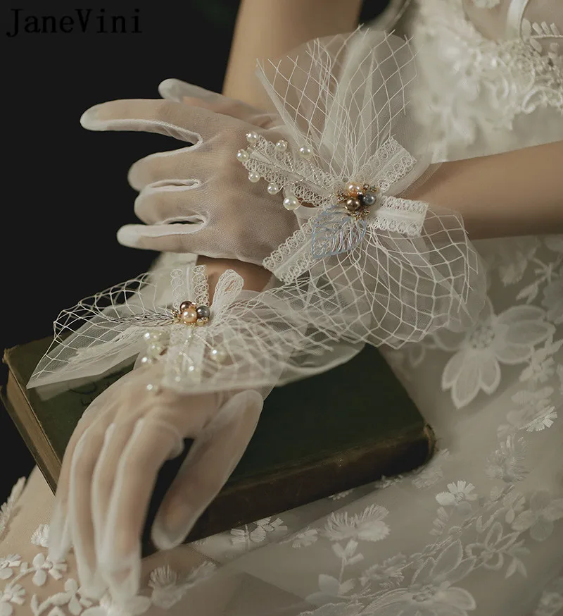 JaneVini-guantes de boda con perlas hermosas para mujer, manoplas de encaje blanco para novia, accesorios de fotografía para fiesta de boda con lazo