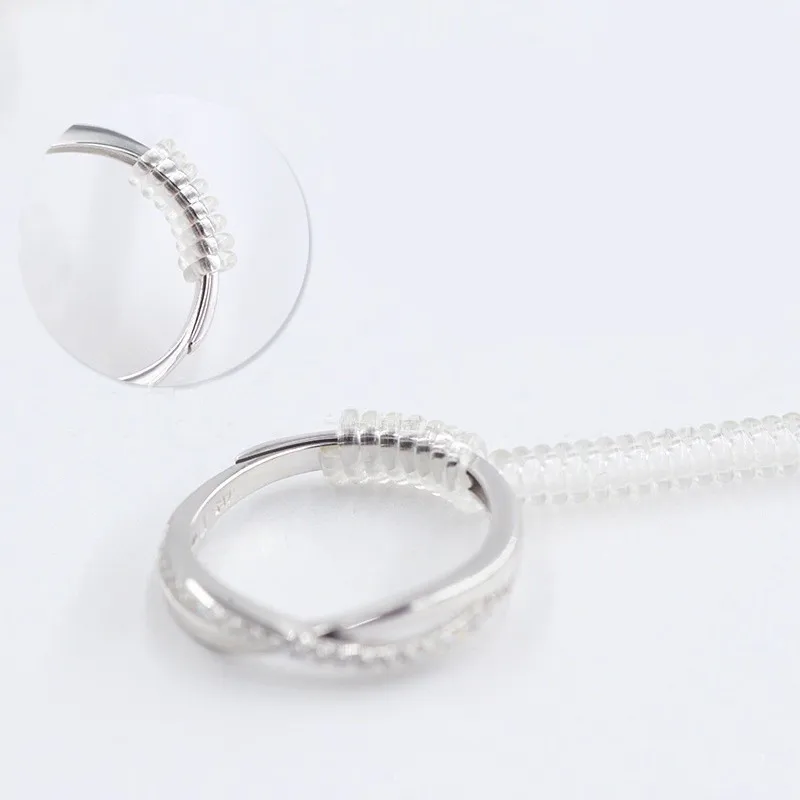 Ajusteur de taille de bague en spirale, 4 pièces, en plastique Transparent, élastique, invisible, adapté à tous les anneaux, outil de bijouterie