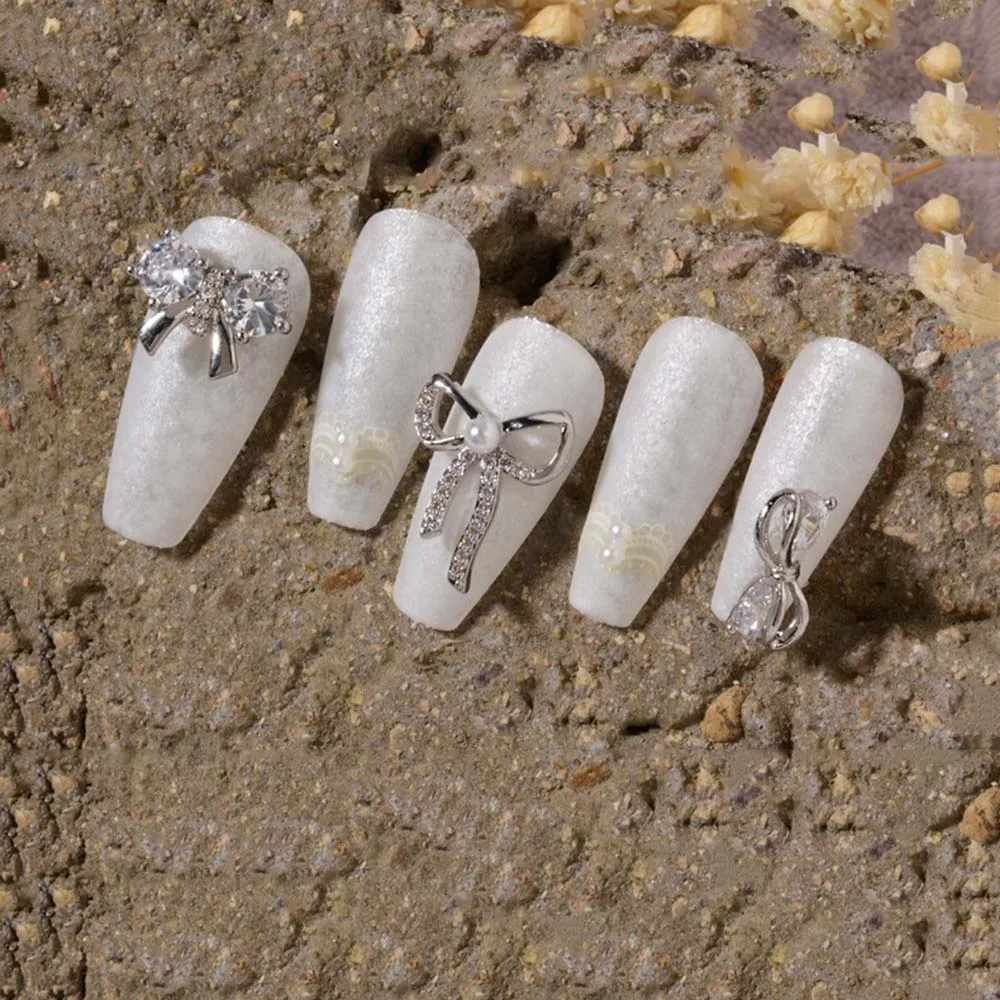 Accessoires de manucure chaîne pendentif perle nœud papillon diamant Nail Art bricolage Nail Art décorations étoile chaîne bijoux ongles strass