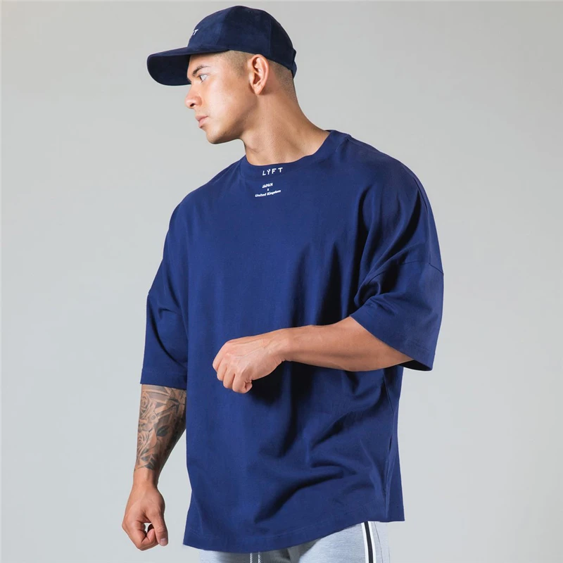 Bieganie ponadgabarytowy T shirt mężczyźni siłownia kulturystyka i Fitness luźny styl życia nosić T-shirt męski Streetwear koszulka w stylu hip-hop