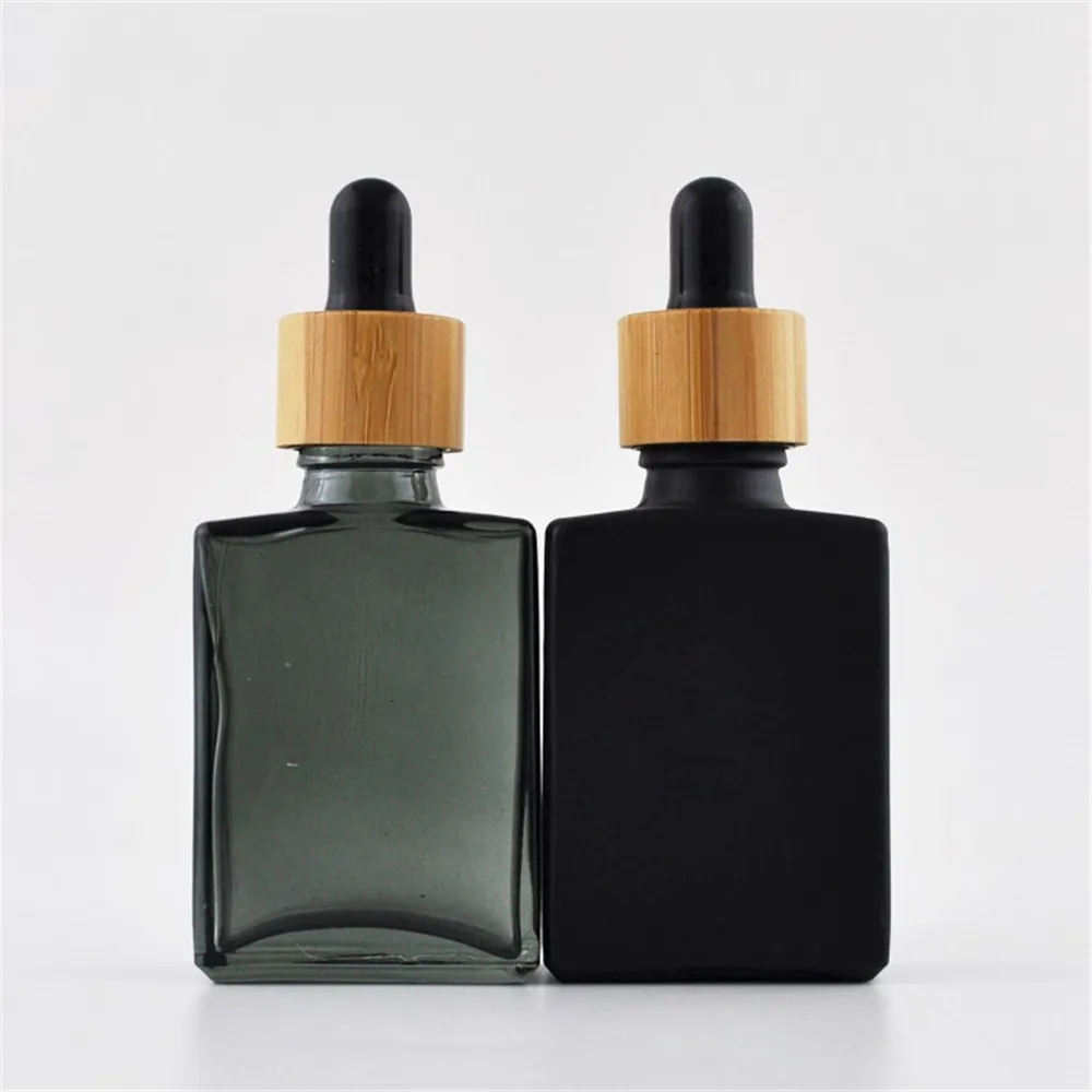 

Luxury Bamboo wooden lid 15ml 30ml 50ml French Square Rectangle Clear/black matte glass dropper bottle with white rubber 1oz