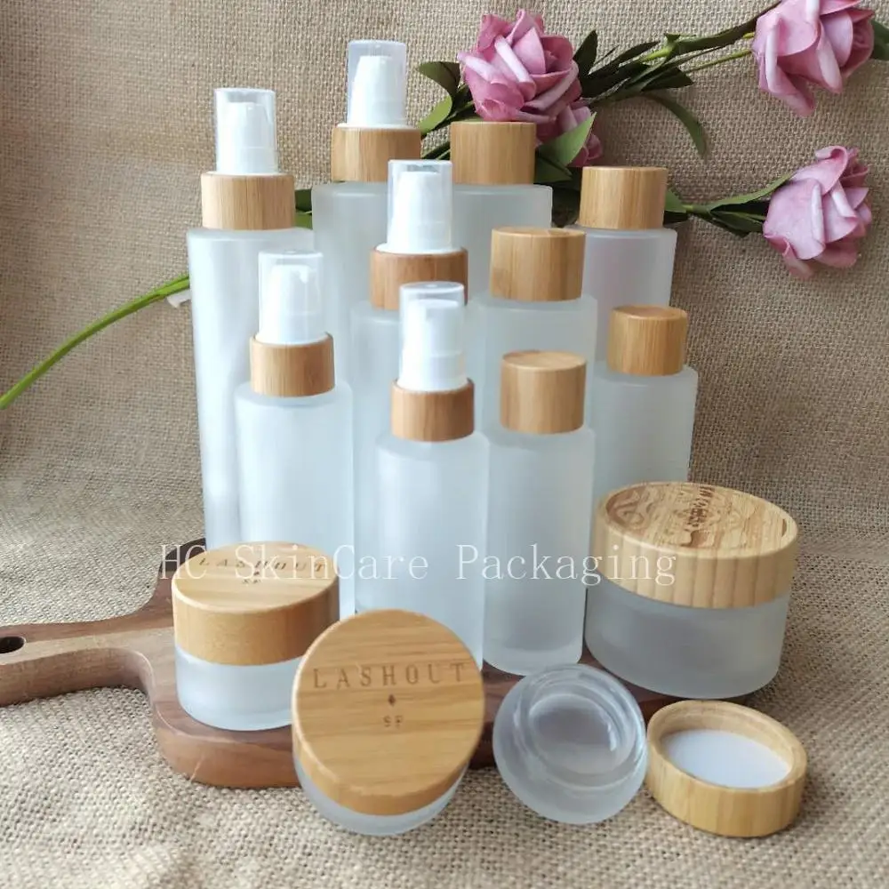 

Frosted Clear Glass Cosmetic Container Emulsion Spray Pump Empty Bottle Cream Jar With Eco Friendly Wood Bamboo Cap Pipette Lid