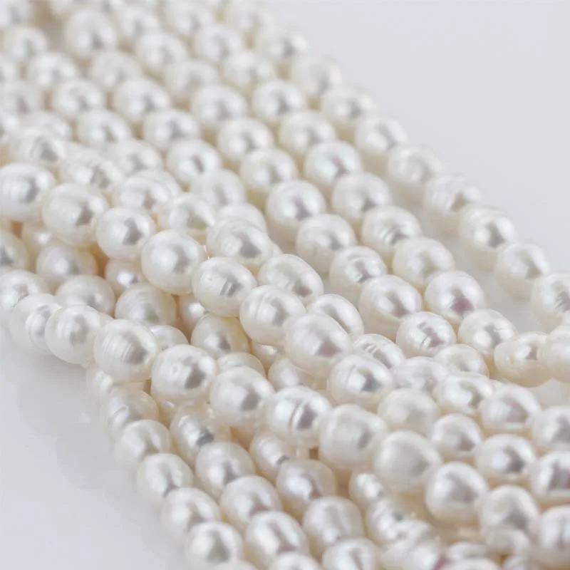 

Genuine wholesale 5 strands 9X11mm AAA grade large size rice pearl strands loose beads-- 16"