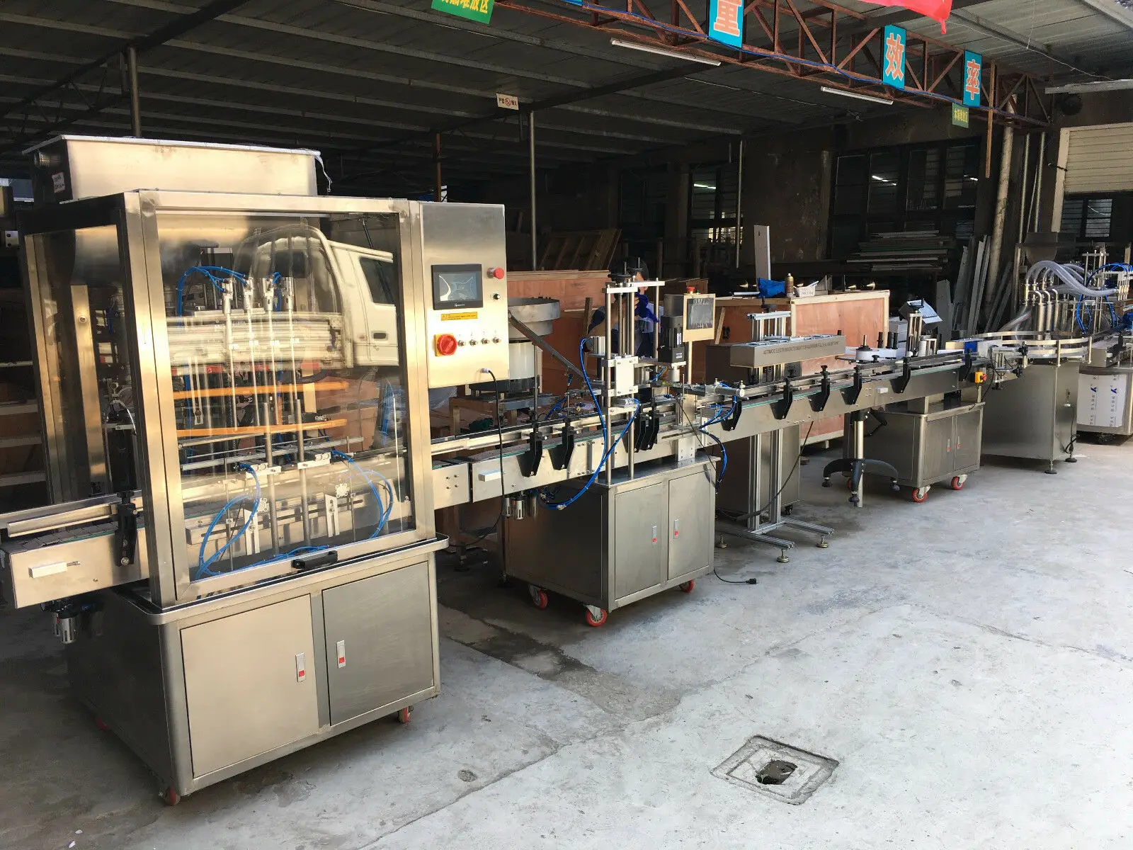 Automatic Liquid Filling Pluging Capping Labeling Machine with Bottle feeders By Sea