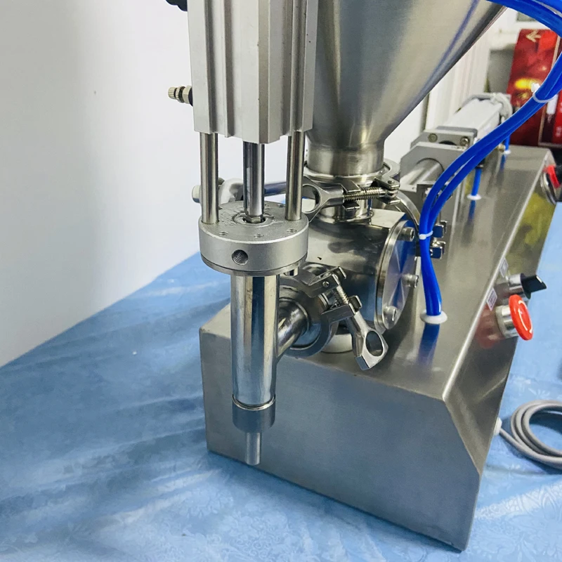 Pequeña máquina neumática de llenado de pasta de un solo cabezal, máquina de llenado eléctrica de productos para el cuidado de la piel, salsa de pasta de propóleo
