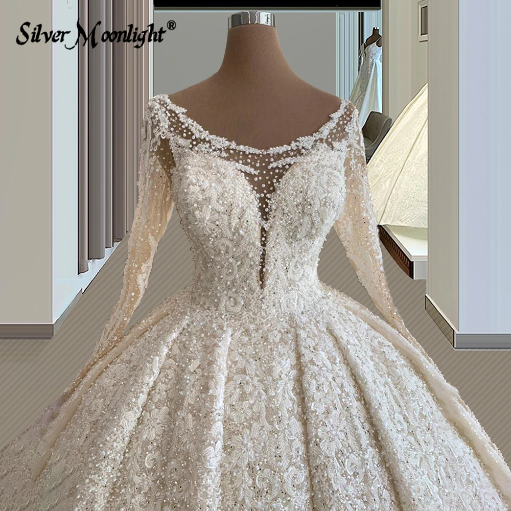 Vestidos de novia de encaje de línea A de manga larga con perlas, elegante cuello redondo, apliques de cuentas completas, tren de corte, vestido de novia Vintage árabe