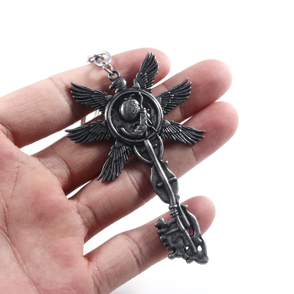 Vintage Six-Winged Unborn Key Pendant Keychain