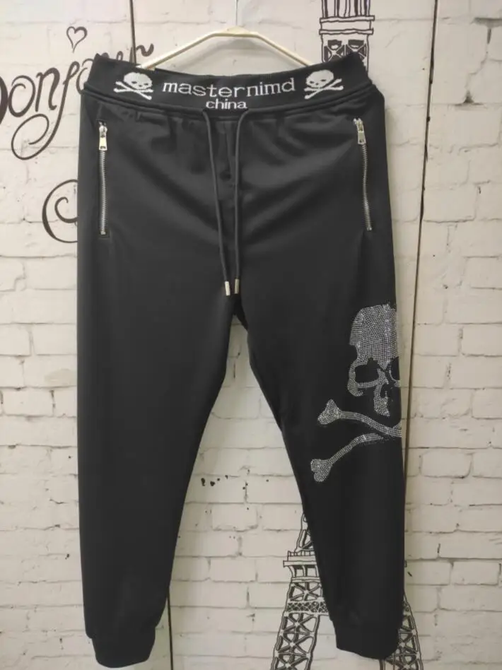 Pantaloni da perforazione a caldo casual da uomo di nuova marca di design estivo Leggings slim pantaloni elastici con teschio scottato da uomo