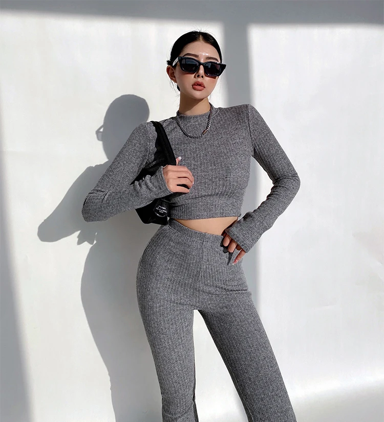 Women High Neck Ribbed Crop Top And Stretch Waist Ribbed Flare Rrousers Co-ord