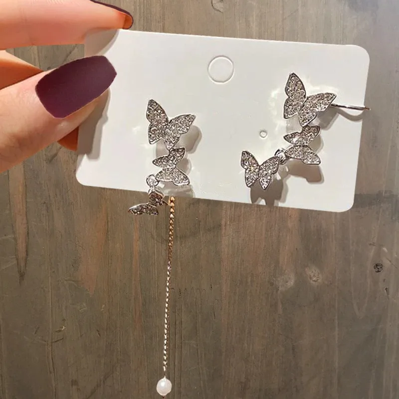 Eleganckie asymetryczne Rhinestone Butterfly Drop kolczyki dla kobiet dziewczynki śliczne modne perły kolczyki z łańcuszka koreańska biżuteria