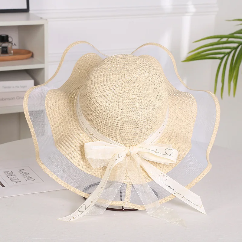 Sombrero plegable de paja con lazo para niña y mujer, sombrero de paja flexible con ala grande, elegante, protección contra la sombra, a la moda,