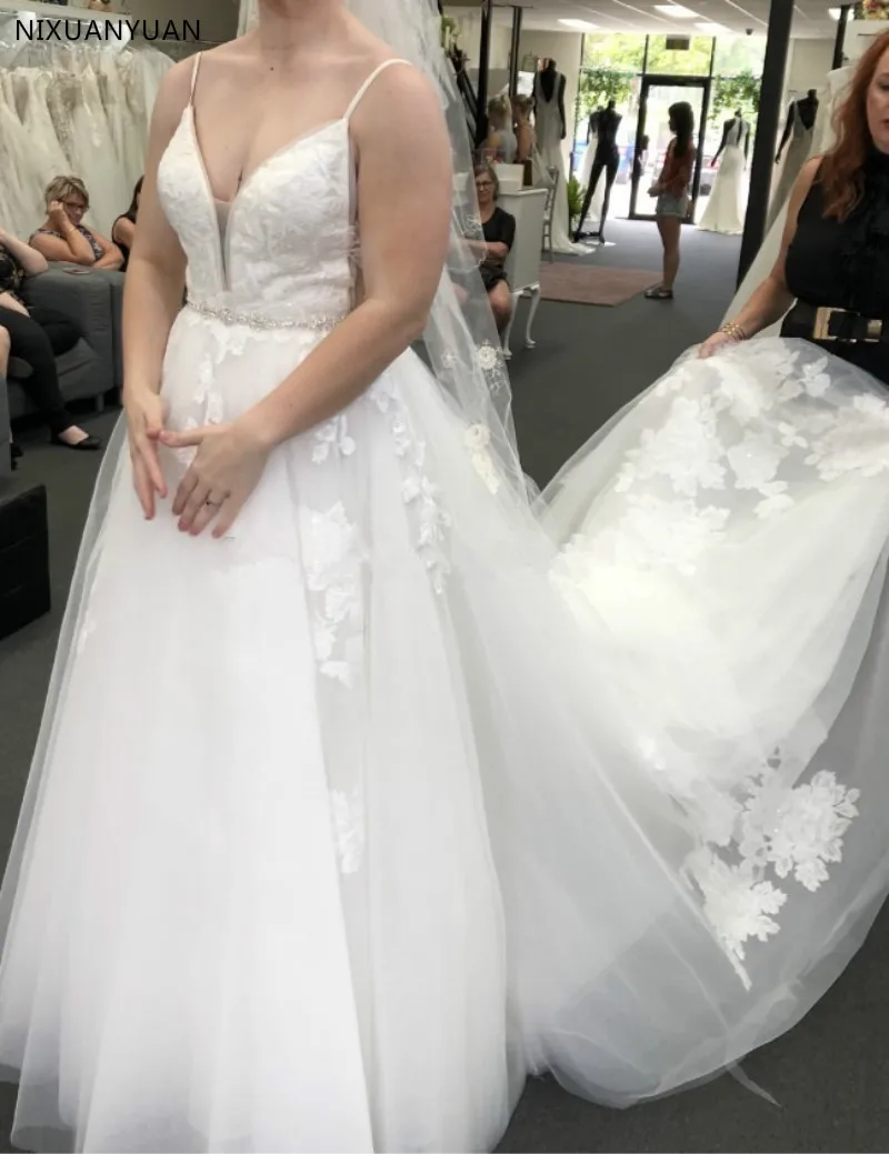 

Fascinating Exquisite A Line Wedding Dresses Lace Applique V Neck Spaghetti Straps Sleeveless Wedding Gowns with Beaded Sash