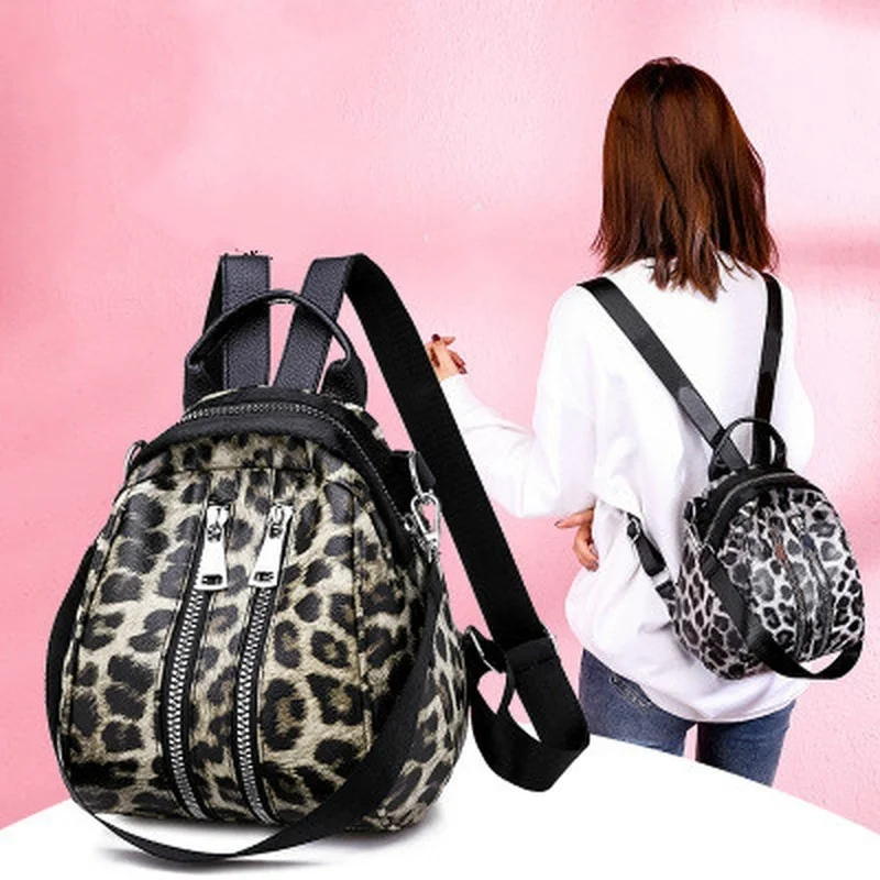 Mochila de viaje con estampado de leopardo para niña, morral escolar de cuero con personalidad a la moda, bolso de mensajero para niña