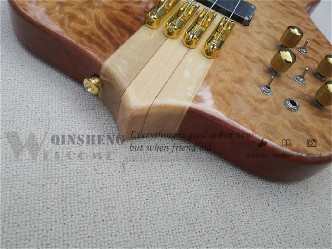 Custom 4 string bass guitar brown squilted maple veneer,mahogany body,gold buttons,active battery