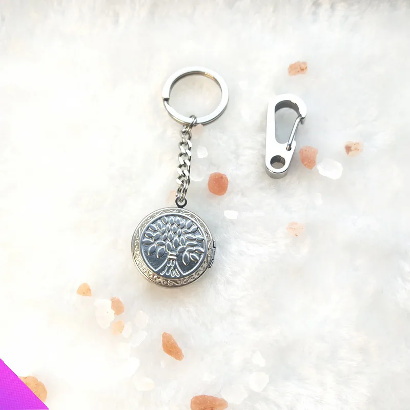 

Wholesale 10 keychain faith amulet tree of life pattern photo frame double-sided embossed pattern photo box key chain souvenir