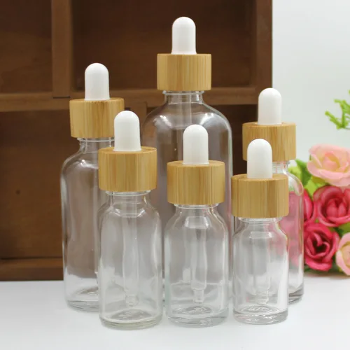 Imagen 1 del producto Botellas cuentagotas de aceite esencial para el cuidado cosmético de la piel, contenedor de pipeta de vidrio de 5ML-100ML, embalaje con tapa de bambú, botella cuentagotas