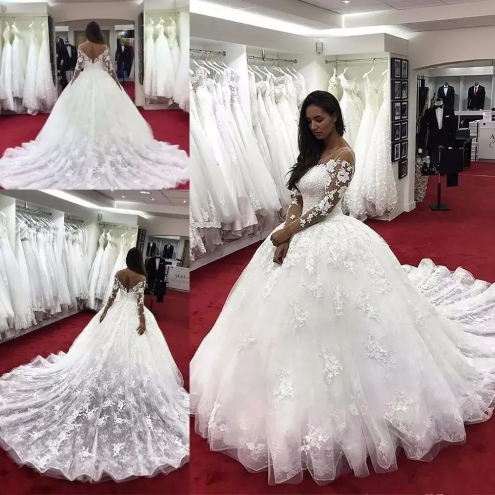 2019 Modern ball gown Wedding Dresses Illusion Neck Long Sleeves Lace Applique Beaded Crystal Sheer Back Plus Size bridal gown