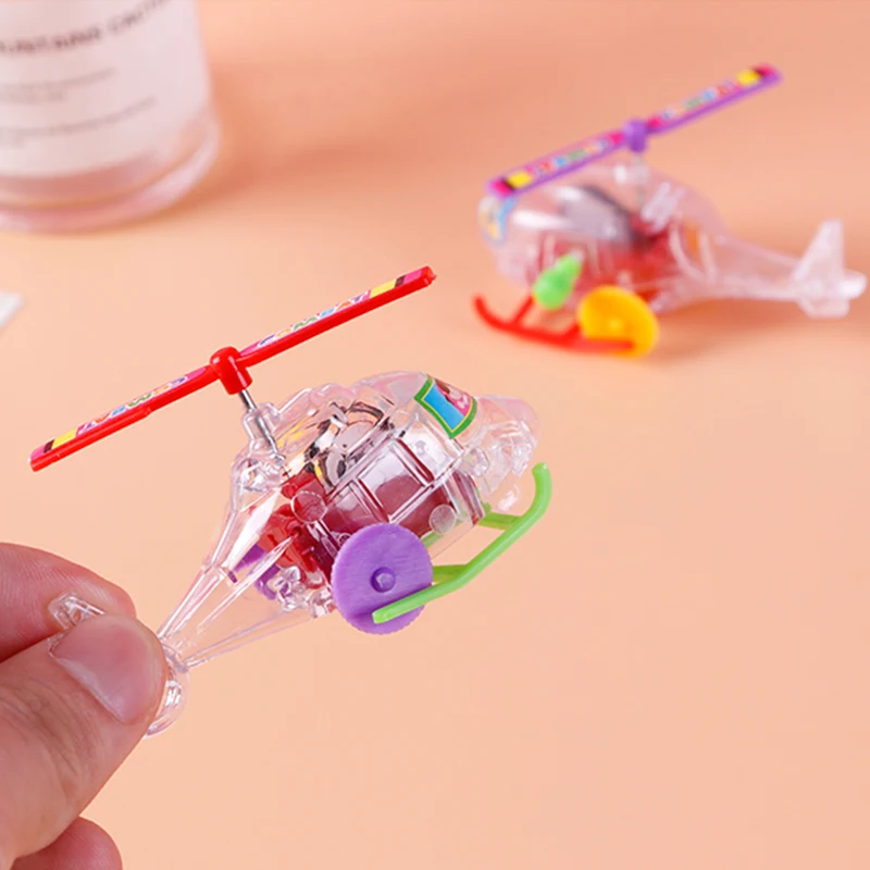 New and interesting wind-up clockwork toy transparent mini airplane helicopter pull-back toy child infant crawling toy
