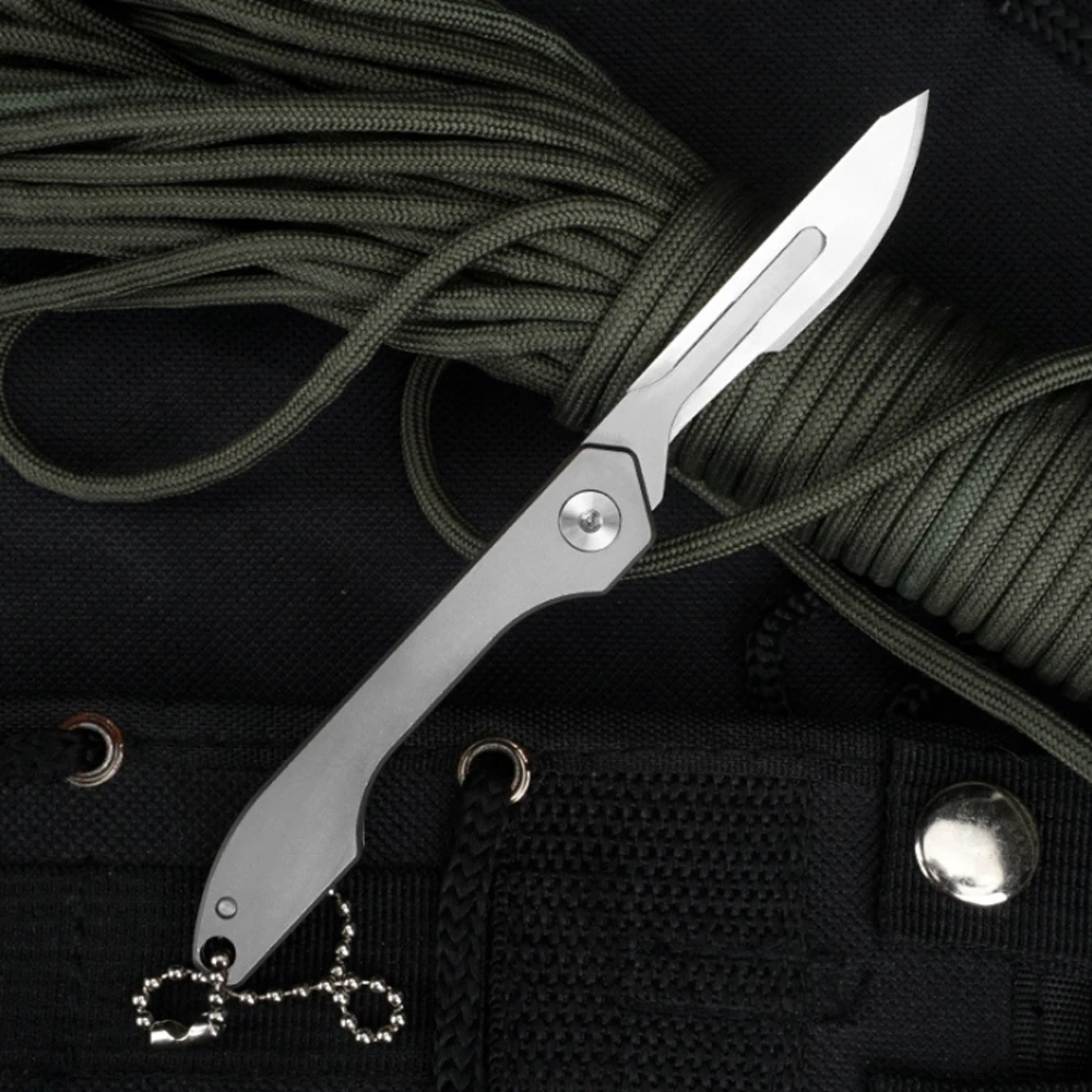 

Titanium Alloy Scalpel Folding Knife With 10pcs Blade Fast Open Removable Blade Outdoor Survival Pocket Utility Knives EDC Tool