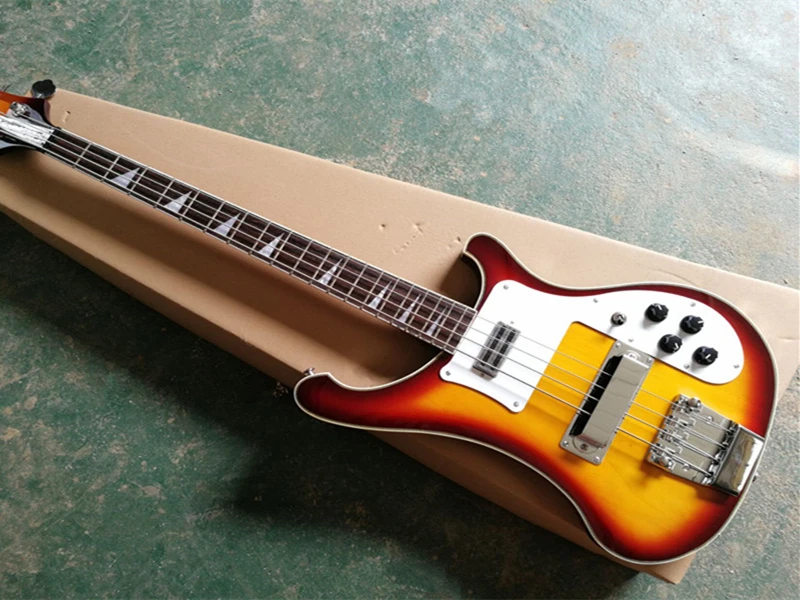 

Sunburst body 4 strings Electric Bass Guitar with White Pickguard,Rosewood Fingerboard,Neck Through Body,Provide custom service