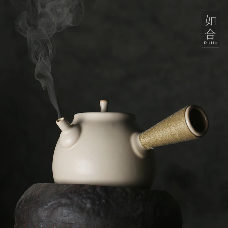 |white clay pottery side the boiling kettle electric TaoLu flame charcoal stove alcohol lamp tea tea warm boiled water