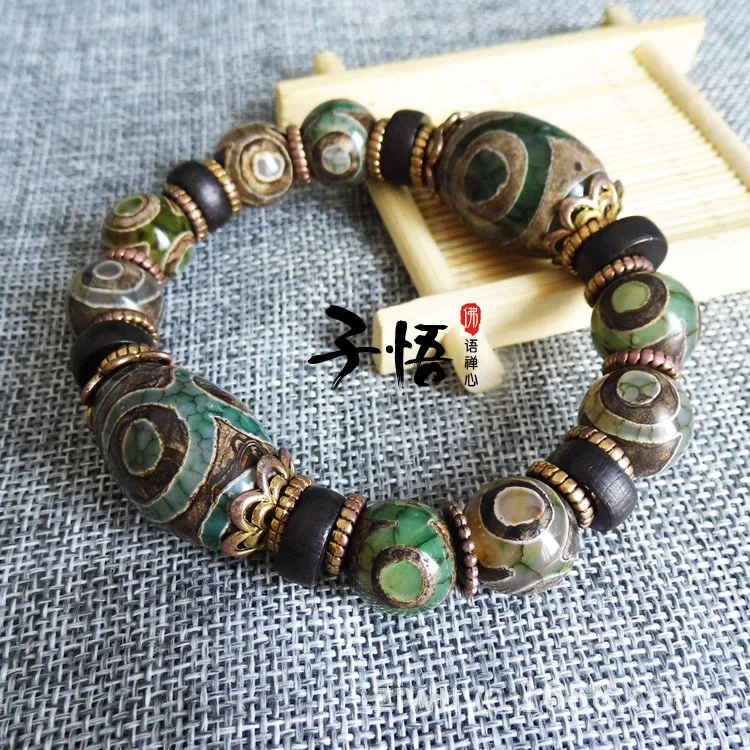 

Manufacturers wholesale original Tibetan antique green three-eyed Dzi Bead bracelet bracelets diy spacer jewelry wholesale.