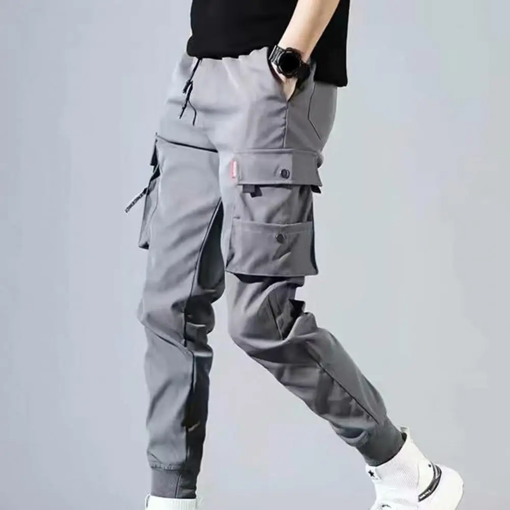 Pantalones Cargo con múltiples bolsillos para hombre, cintura elástica y cordón, Color sólido, delgados, pies de haz, guapo, 2024