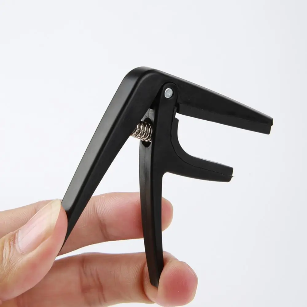 

Professional Ukulele Capo 4 Strings Guitar Capos Single-handed Quick Change Ukelele Capo Guitar Parts & Accessories