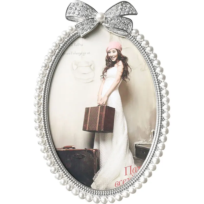 

Shiny Silver Plated Zinc Alloy Picture Frame With White Pearls And Clear Rhinestones Jeweled Ribbon In 3 Size Round Oval Shapes