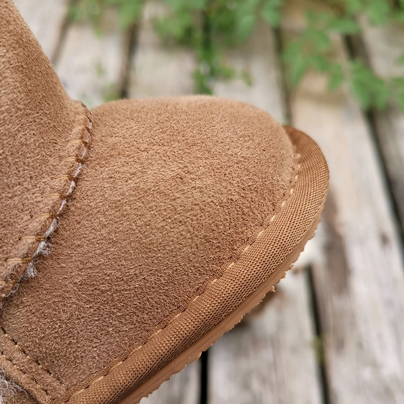 Zapatos de piel de oveja para bebé, botas para niño y niña, diseño de lujo para evitar resbalones, de lana cálida