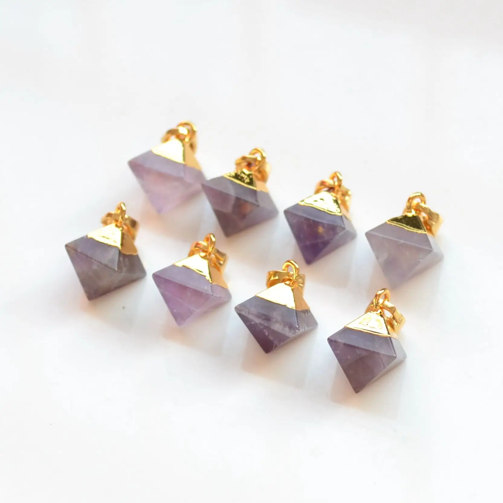 

Nature faceted pyramid amethysts Terminated pendant with Electroplated gold edge