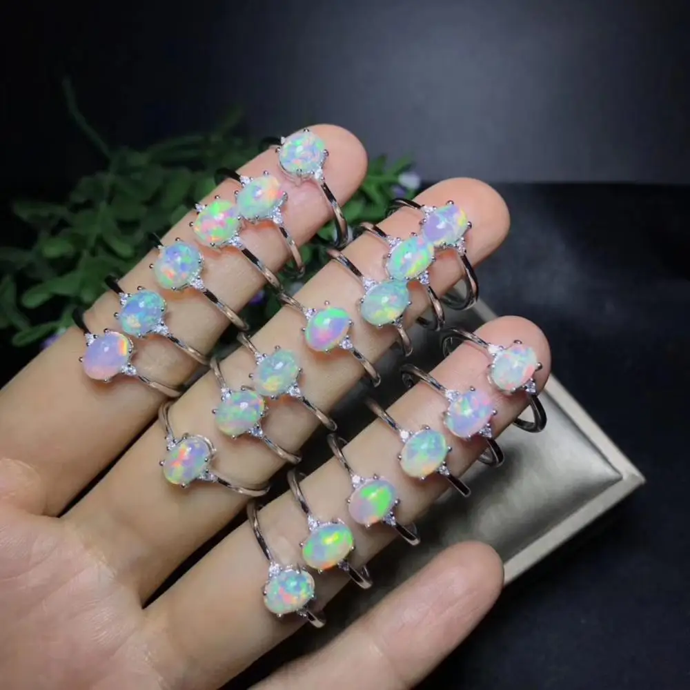 

Shop new products, recommended by the owner Natural opal woman rings change fire color mysterious 925 silver adjustable size