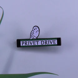 Cute Hedwig enamel pin the snowy owl perched on the Privet Drive street sign