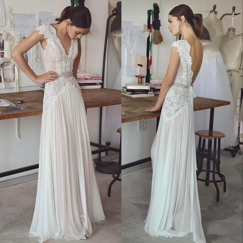 Suknie ślubne w stylu boho 2026, suknie ślubne w stylu bohemy z krótkimi rękawami, dekolt w serek, odkryte plecy, plisowana spódnica, elegancka suknia w kształcie litery A, możliwość personalizacji.