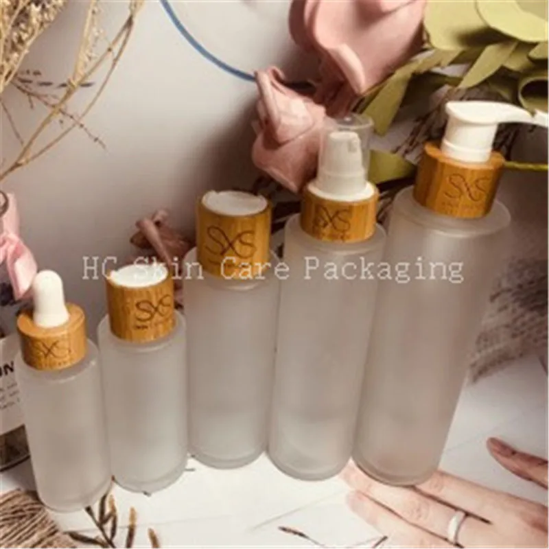 

Empty Packing Wholesale 30ml 50ml 100ml 120ml 150ml Engraving Logo Frosted Glass Bottles for Cosmetics Bottles with Bamboo Lid