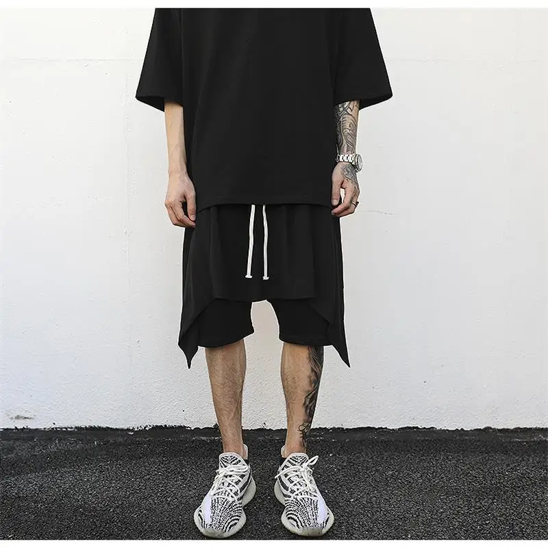 Men's hip-hop style personality trend asymmetry spliced tight waist five minute pants high street style harem pants