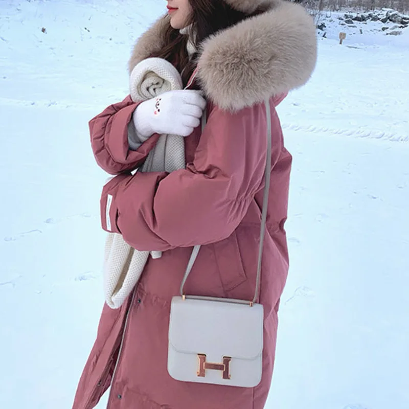 Chaqueta de plumón de pato blanco para mujer, abrigo grande de piel Artificial y Real con capucha, largo, suelto, grueso, de oficina, elegante,