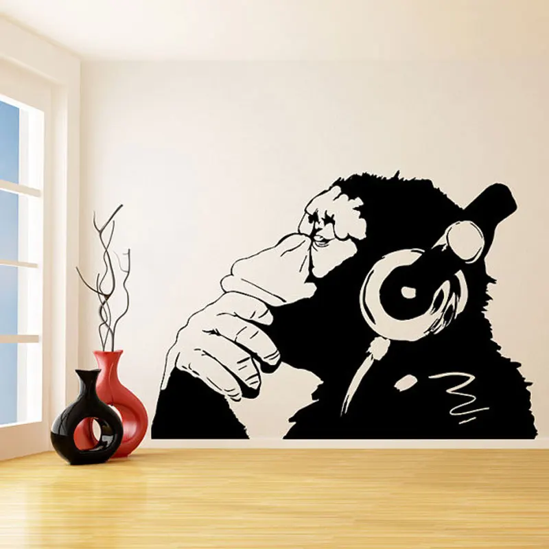 

Banksy Vinyl Wall Decal Monkey With Headphones One Color Chimp Listening to Music in Earphones Street Graffiti Sticker