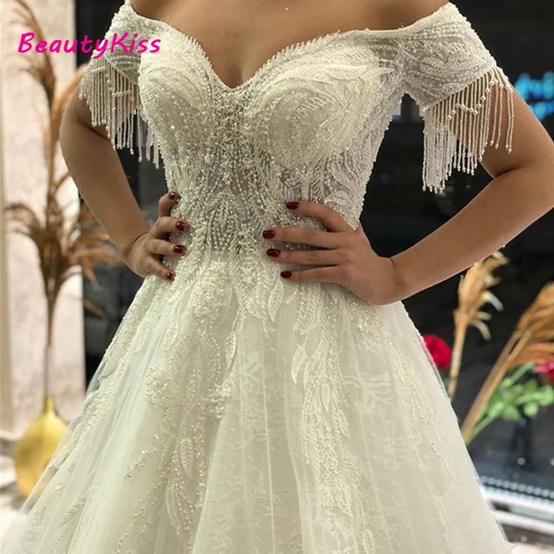 A linha vestidos de noiva princesa fora do ombro frisado borla pérola vestidos de noiva rendas apliques vestido de noiva para mulher