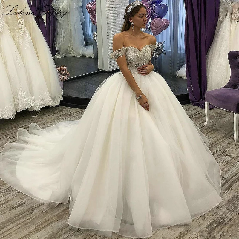 

Lceland Poppy Customized Ball Gown Tulle Wedding Dresses Off the Shoulder Crystal Beaded Floor Length Bridal Gowns