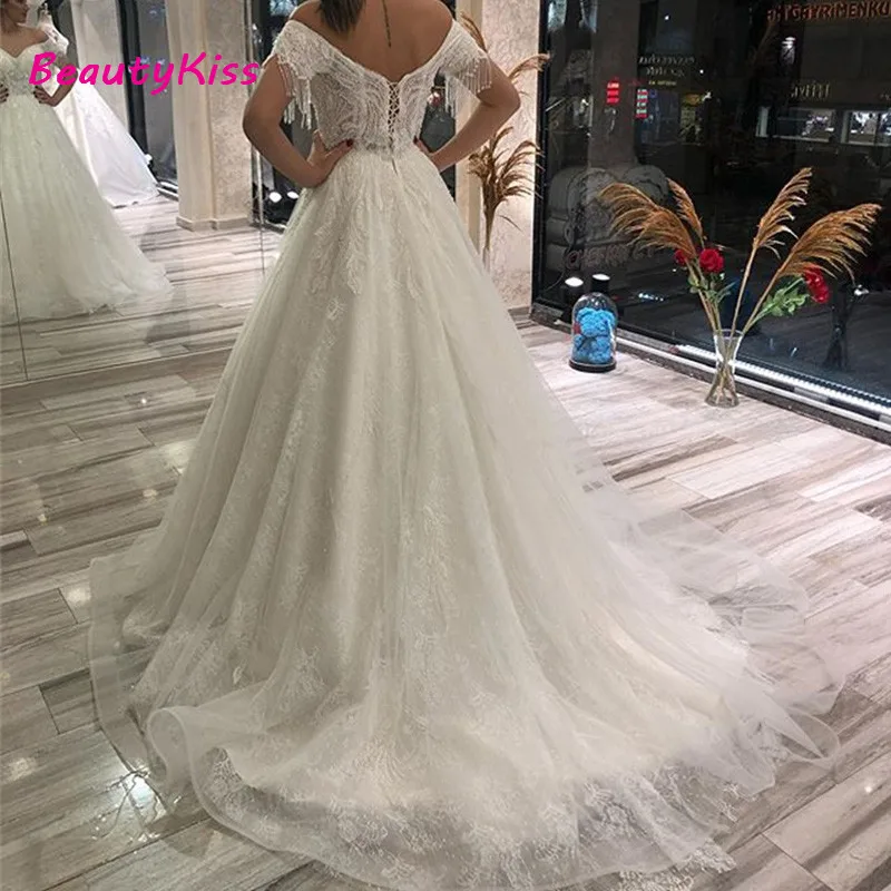 A linha vestidos de noiva princesa fora do ombro frisado borla pérola vestidos de noiva rendas apliques vestido de noiva para mulher