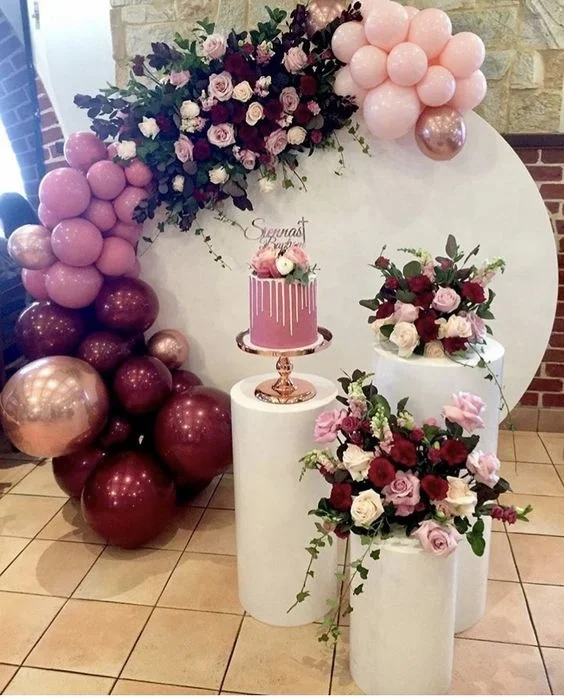 Beautiful floral balloon hoop styled with dessert stands without balloon garland with pink flowers backdrop stand