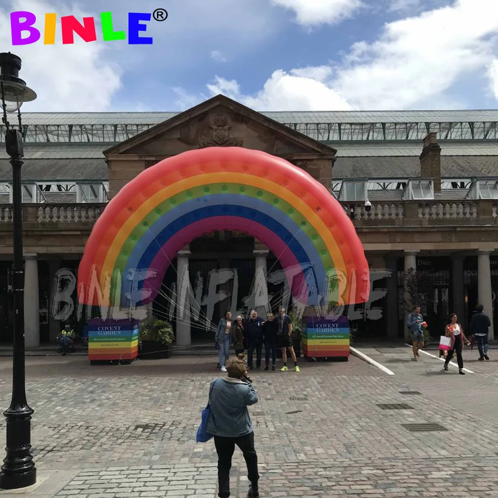 Customized colorful giant flying inflatable rainbow arch with pvc material event parade airtight balloon for holidays decoration