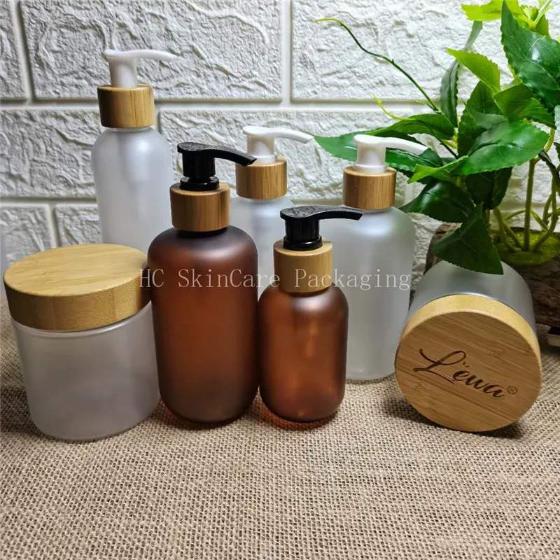 

Eco-friendly wooden lid bamboo cap frosted transparent matte amber plastic bottles and jars skin care cream jar bulk wholesale