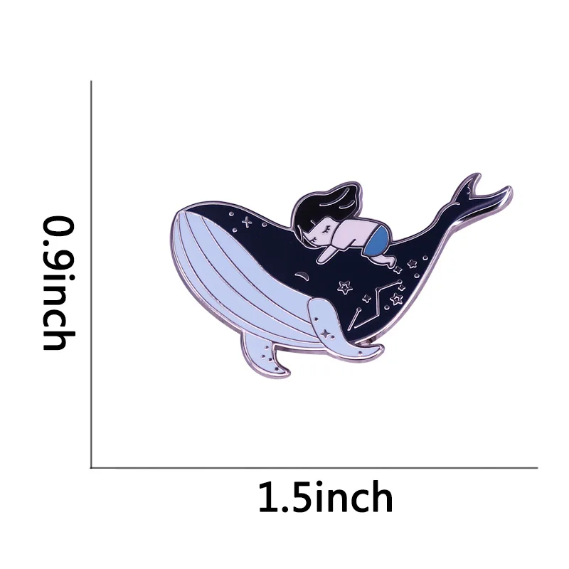 This beautiful badge tells a story of whale and girl, both lovers of the sea and coexisting in this galaxy.