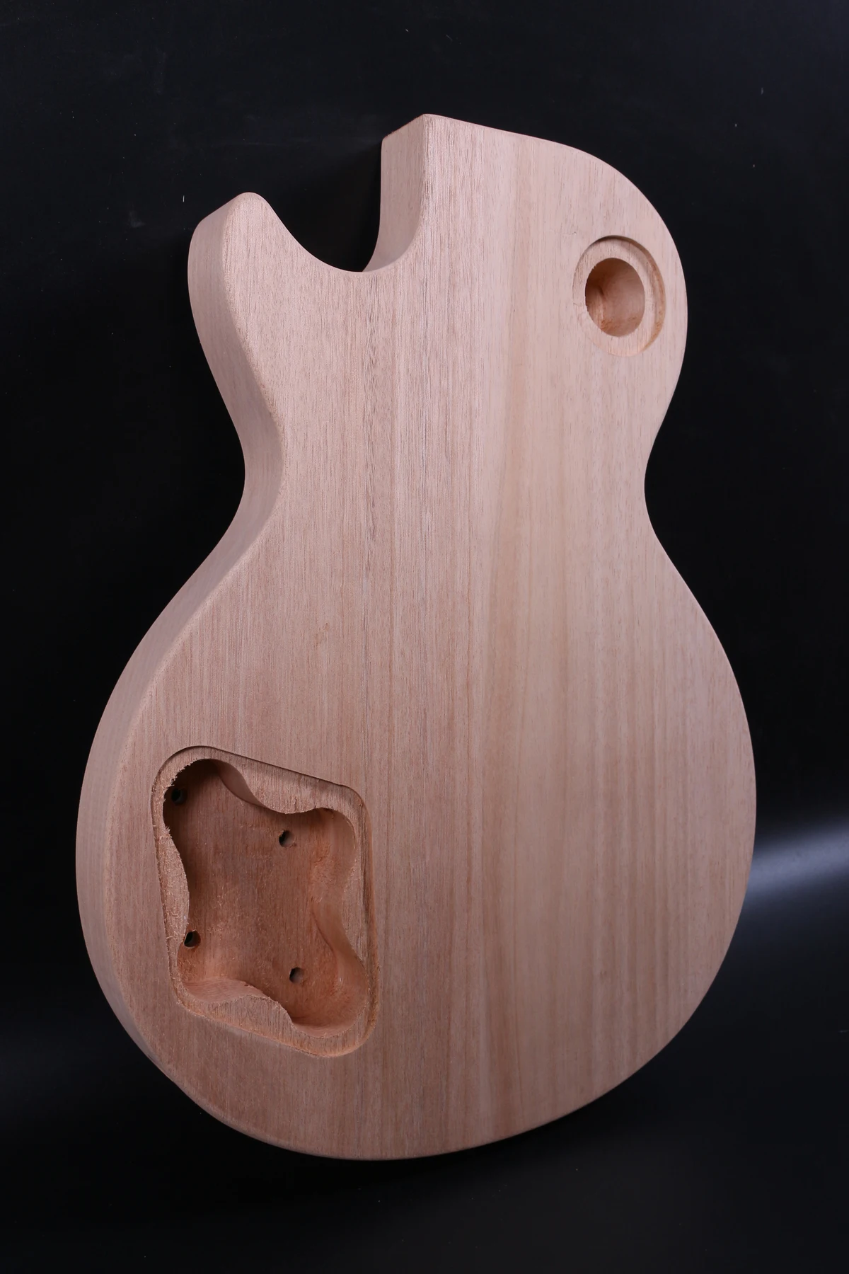 one right hand unfinished electric guitar  body    mahogany made  and maple top high quality