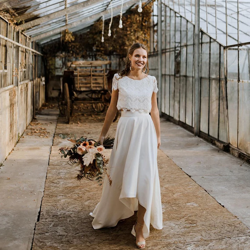 Vestidos de novia de encaje de dos piezas, cuello de Joya, manga corta, falda alta y baja, venta al por mayor, 2023