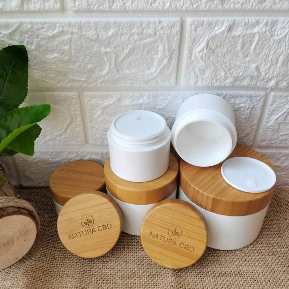 

Luxury Empty White PP Plastic Skin Care Cream Jar Cosmetic Eye Cream Body Cream Jar Packaging Containers With Bamboo Wood Lids