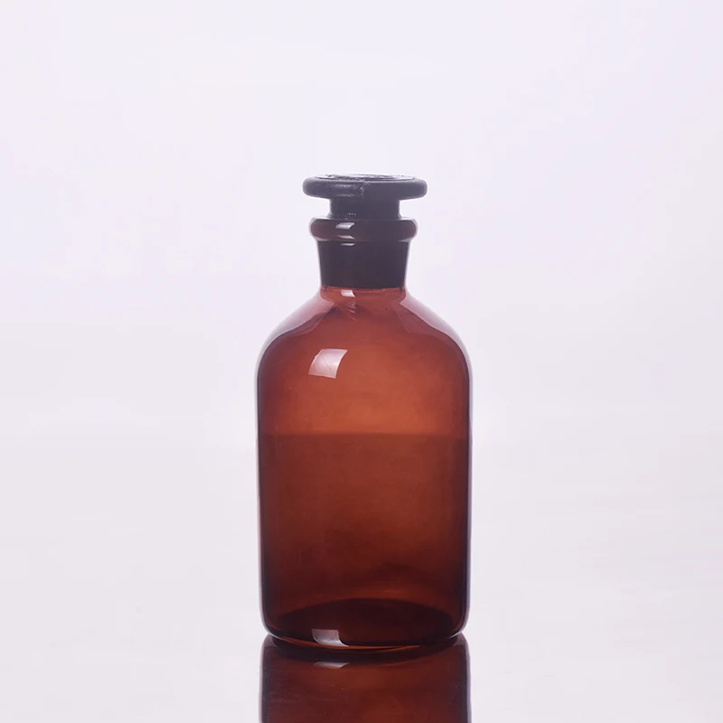 

Brown Reagent bottle,Narrow neck with standard ground glass Hollow/Solid stopper,Clear,Boro. 3.3 glass,250ml,Sample Vials